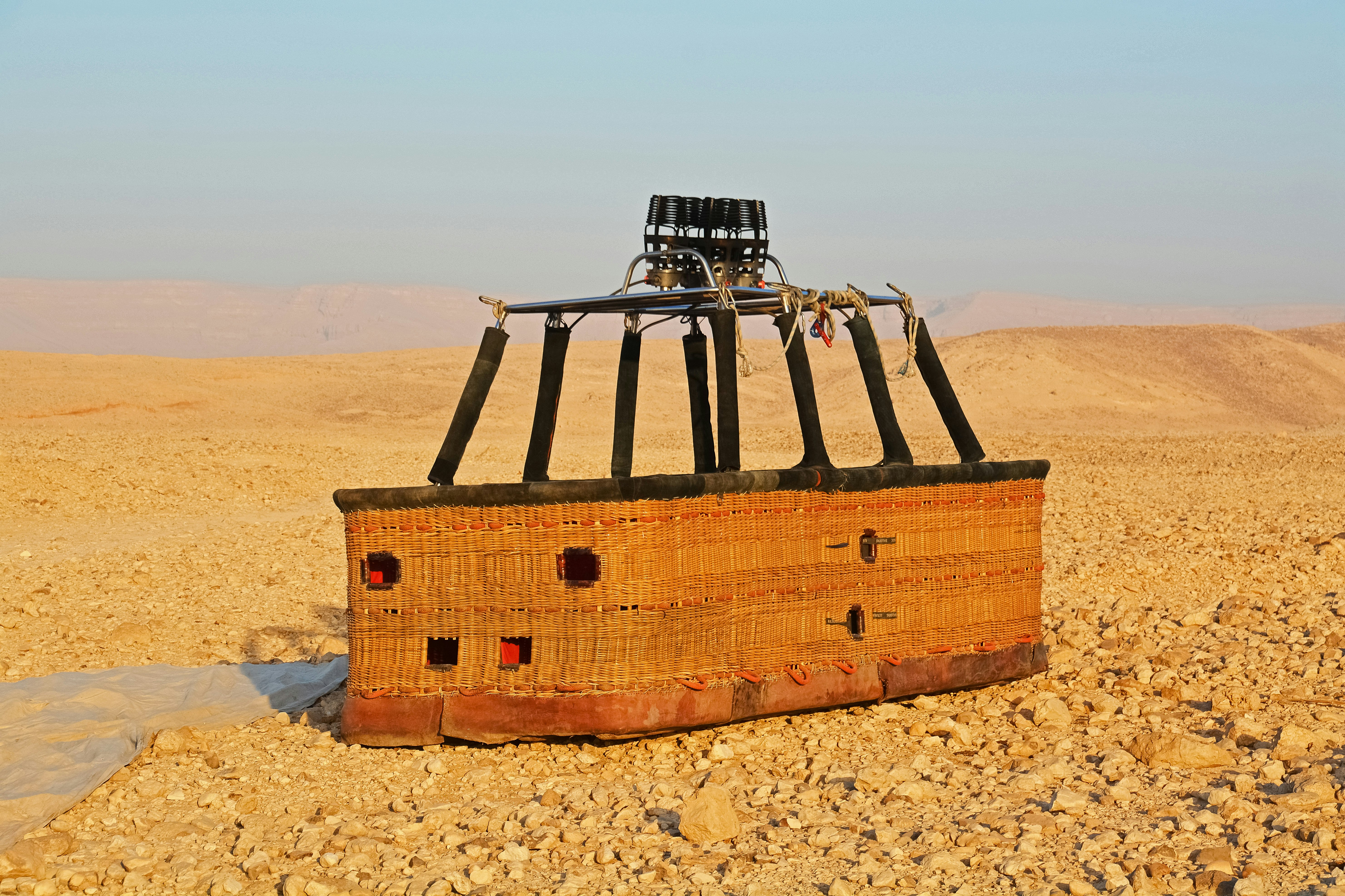 brown wooden boat on brown sand during daytime